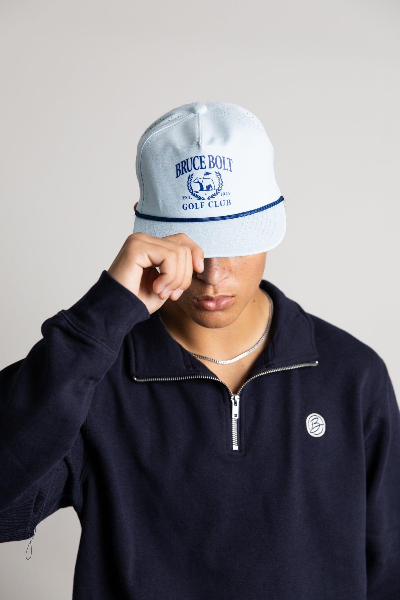 bruce-bolt-rope-snapback-with-bruce-bolt-golf-club-logo-baby-blue-5-panel-standard-rope-hat-popular-designs-100029.jpg